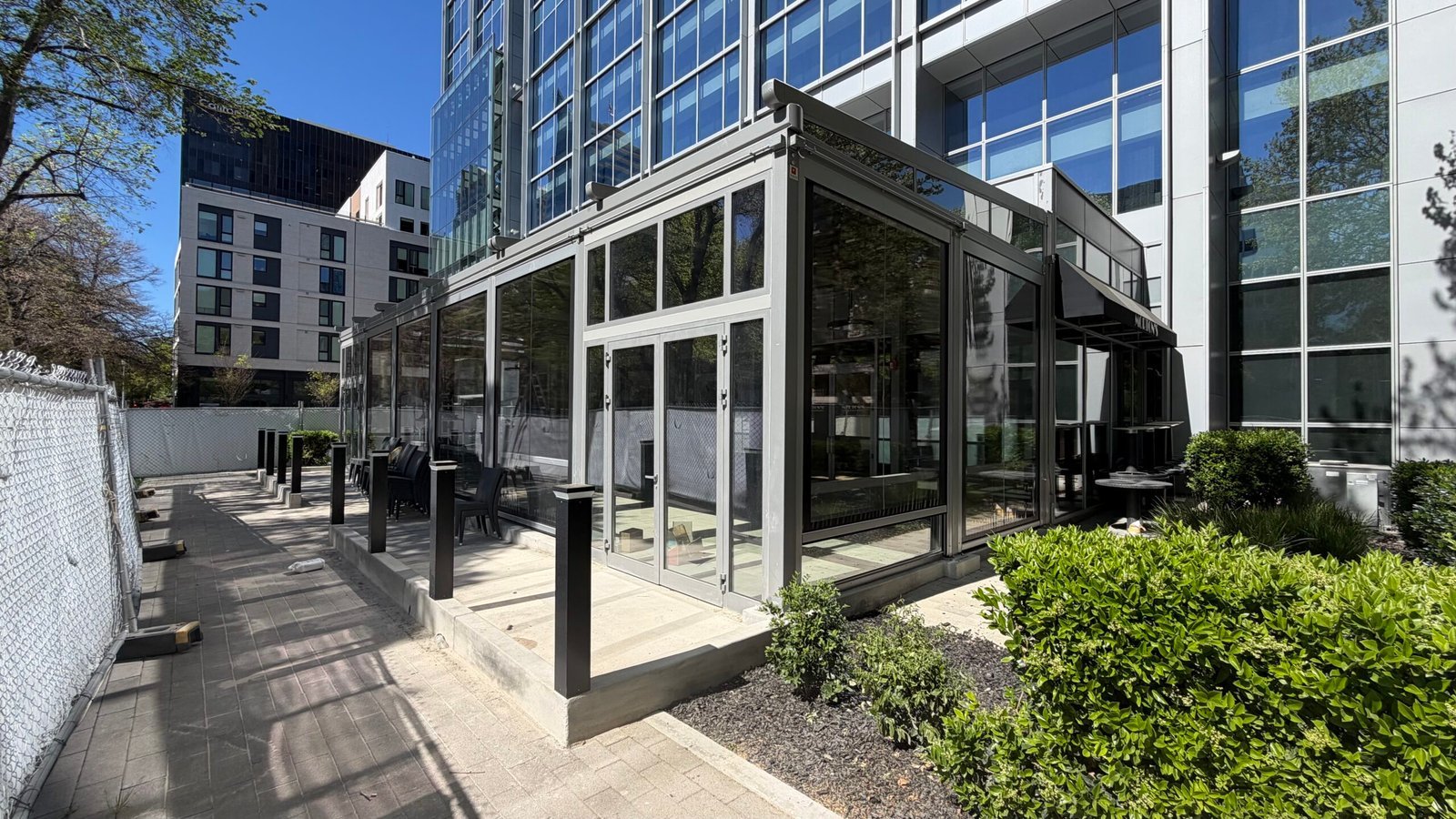 Glass-enclosed steakhouse patio in Sacramento